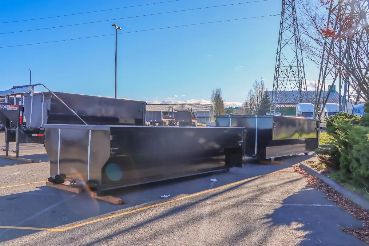Roll-off dumpster ready for waste disposal at job site for Roofing Dumpster Rental in Swansea